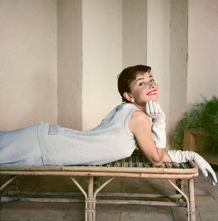 Audrey Hepburn on a rattan lounge chair, 1955 by Norman Parkinson – Limited Edition Print.