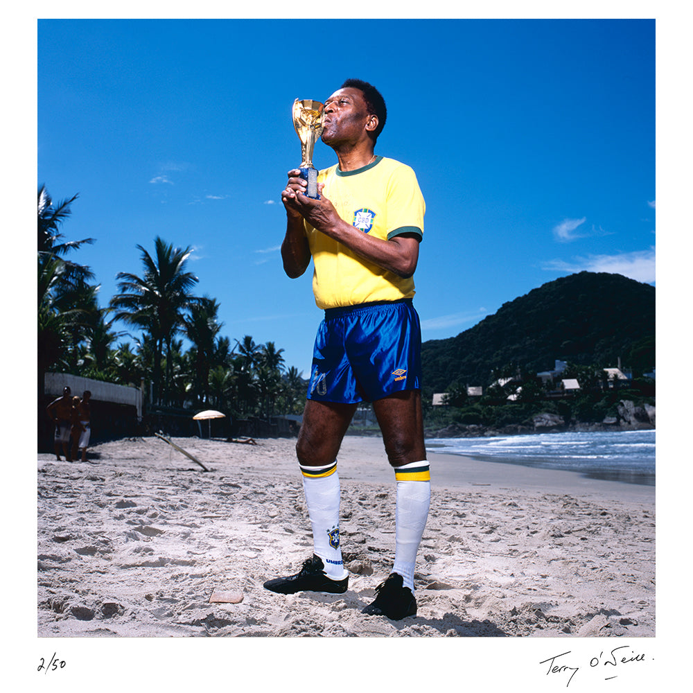 Pelé kissing the World Cup Trophy, 2013 by Terry O'Neill – Limited Edition Print.
