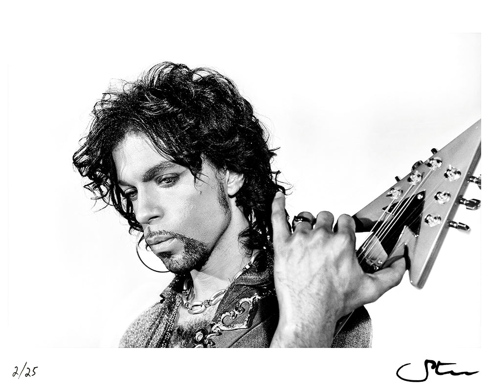 Prince posing with his Auerswald symbol guitar, 1999 by Steve Parke – Limited Edition Print.