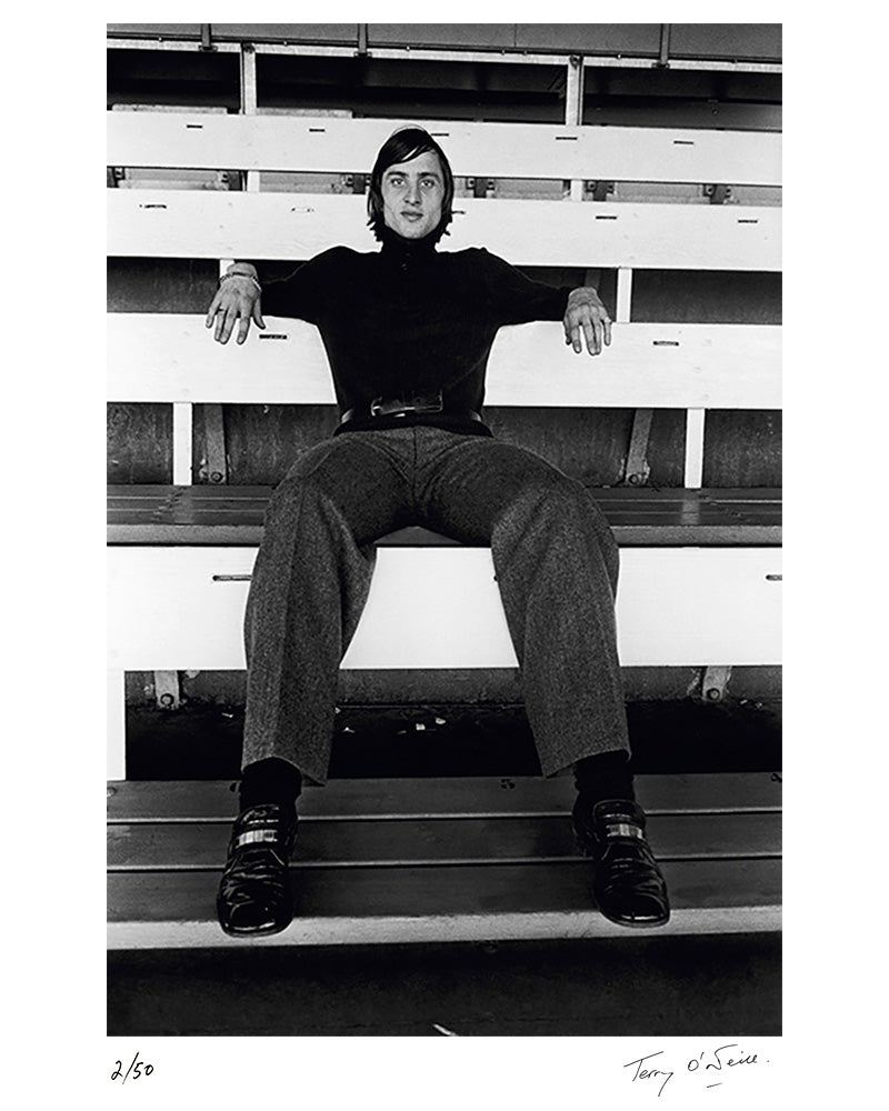 Johan Cruyff sitting in the stands, mid 1970s by Terry O'Neill – Limited Edition Print.